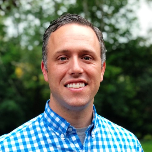 Evan Hickok standing in his backyard
