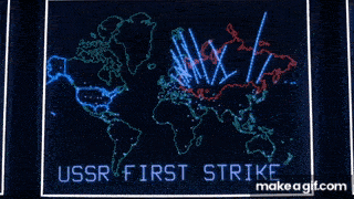 Animated map from the 1983 film wargames showing a simulated nuclear attack. Blue and red digital missile trajectories arc across a world map, indicating an escalating global conflict. The words “ussr first strike” flash at the bottom, highlighting the simulated origin of the launch. The visual evokes cold war tensions and automated war planning.
